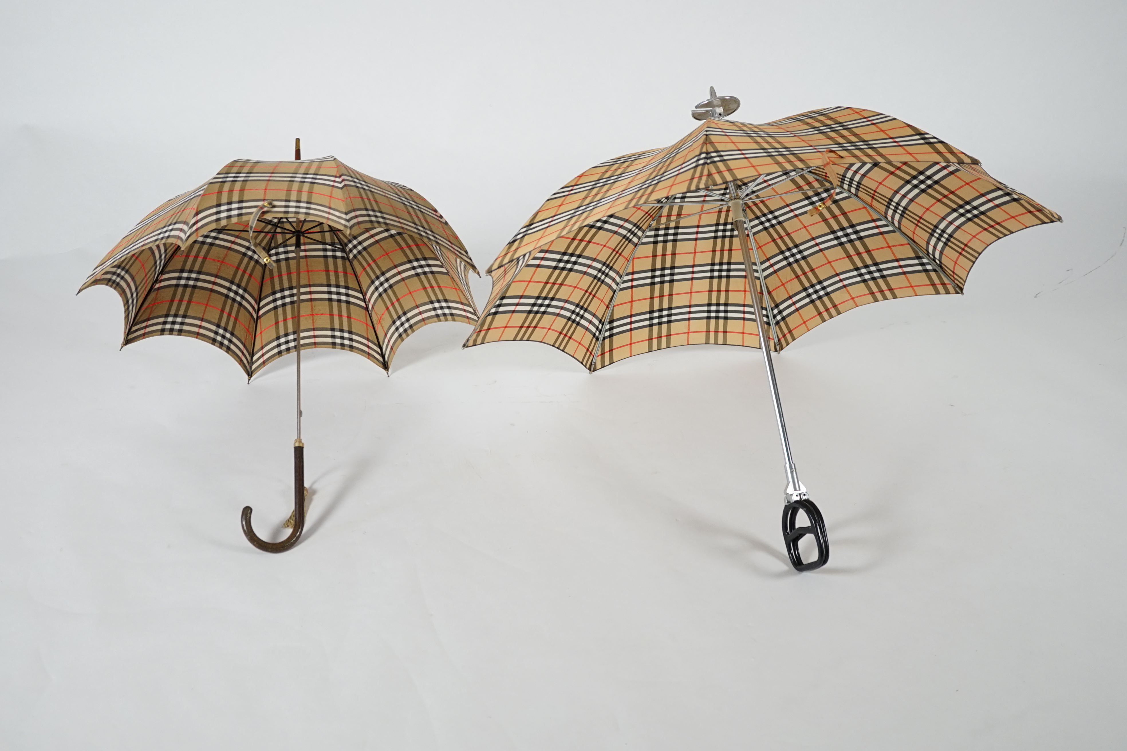 A vintage Burberry shooting stick umbrella and a lady's vintage cotton umbrella, shooting stick height 91cm, umbrella 83cm
